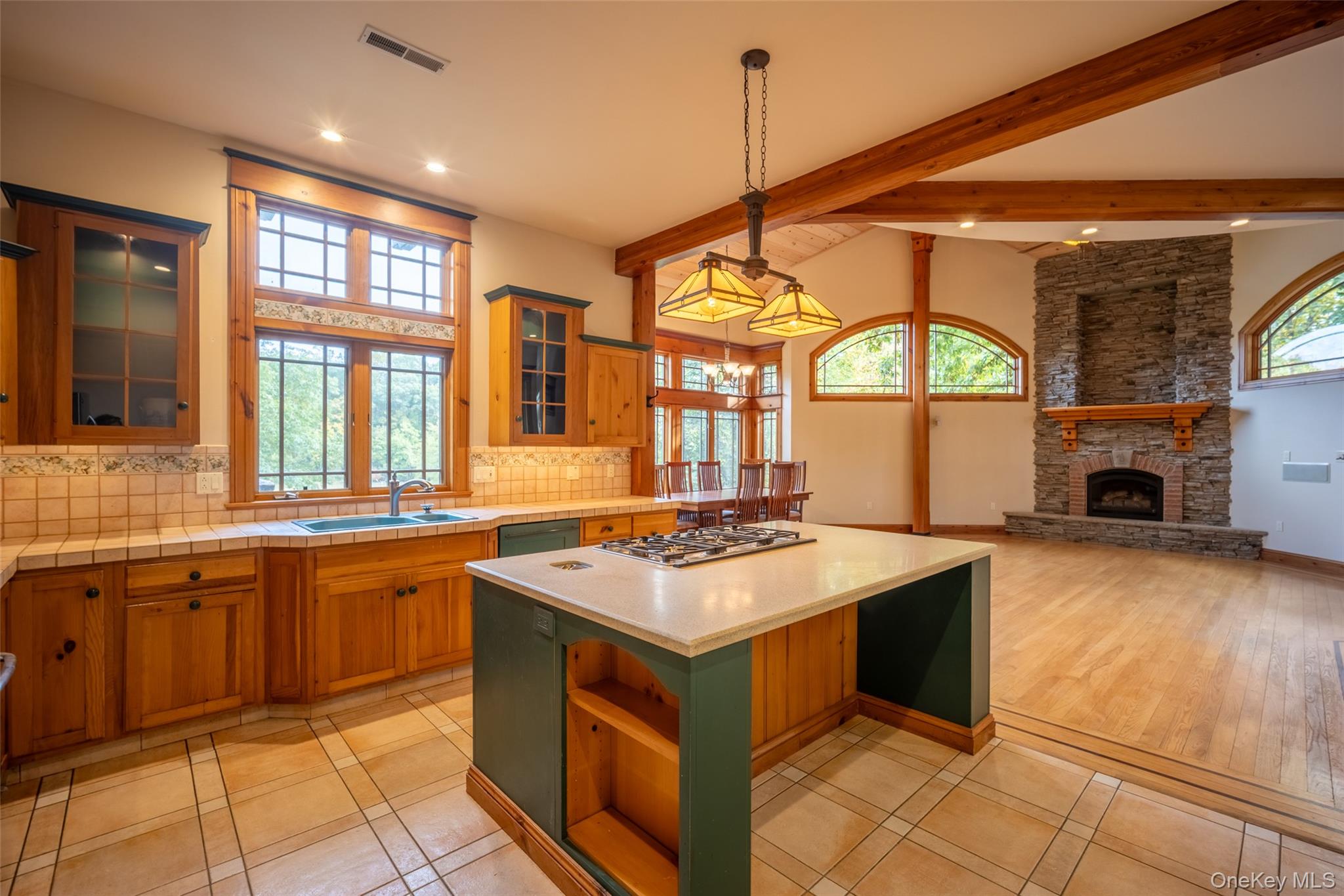 243 Hawleys Corners Road Highland, NY 12528 - Photo 11 of 44 a kitchen with a stove a sink a counter space and a window