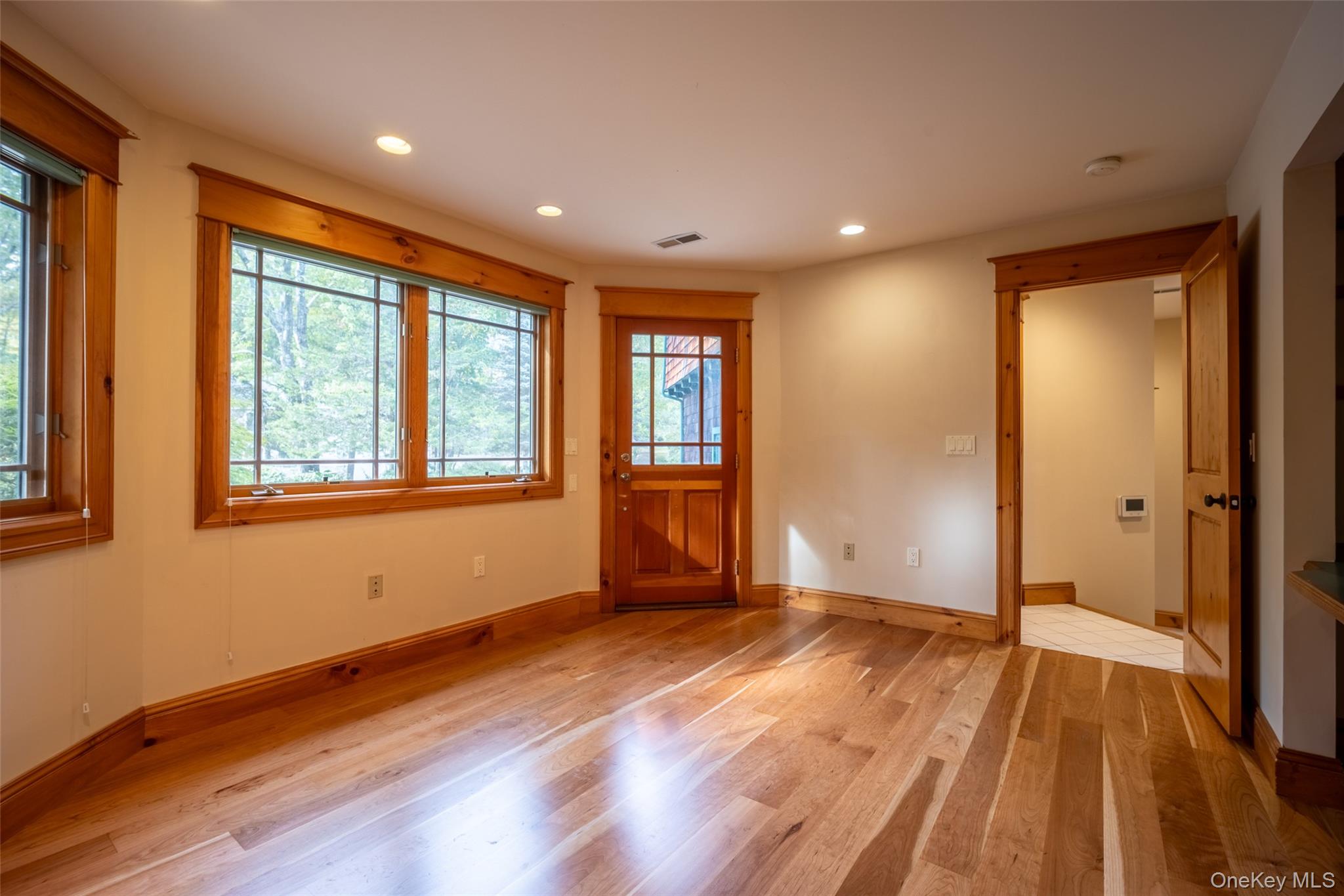 243 Hawleys Corners Road Highland, NY 12528 - Photo 14 of 44 a view of empty room with wooden floor and fan