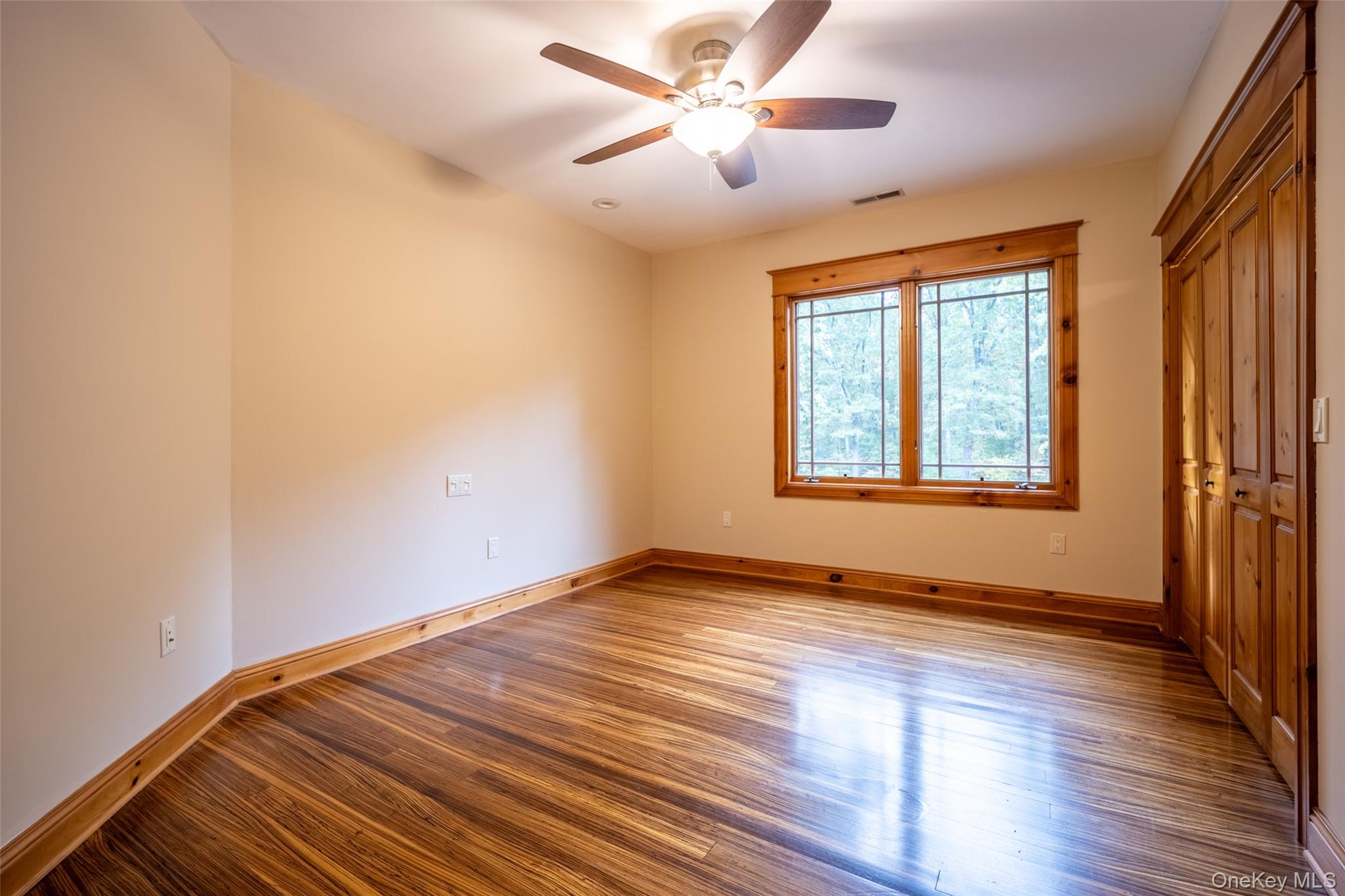 243 Hawleys Corners Road Highland, NY 12528 - Photo 23 of 44 a view of an empty room with window and wooden floor