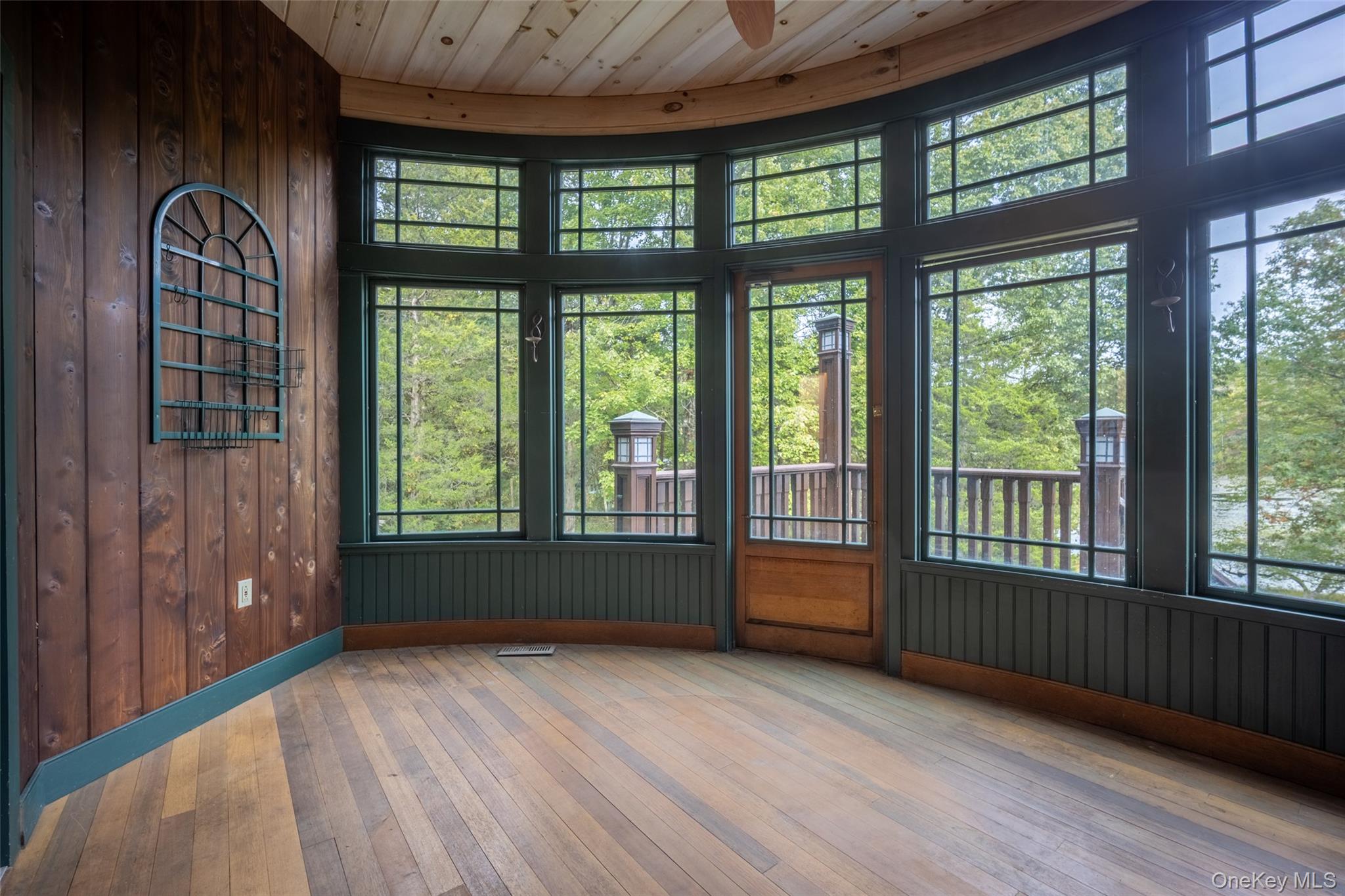 243 Hawleys Corners Road Highland, NY 12528 - Photo 27 of 44 an empty room with wooden floor and windows