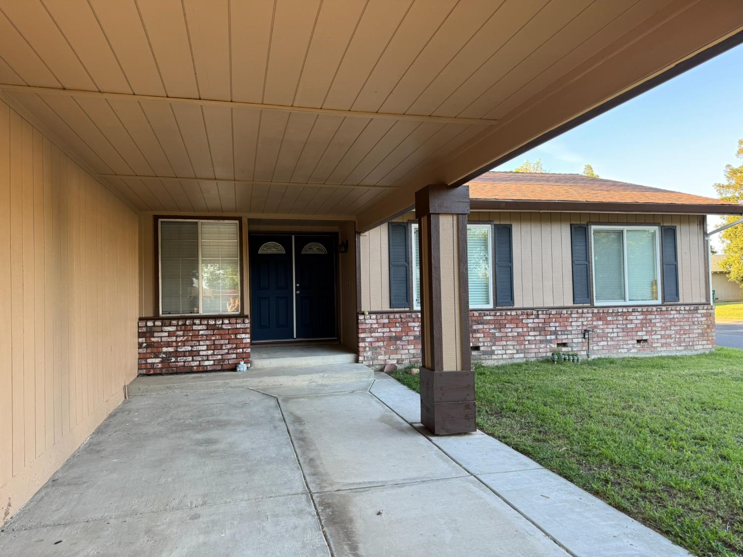 a front view of a house with a garden
