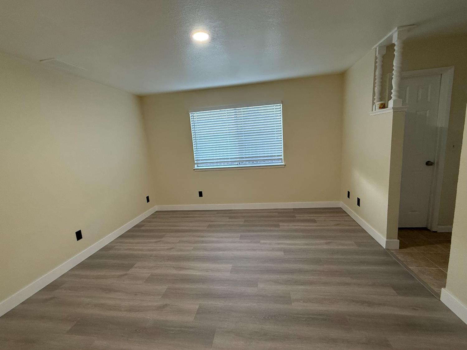 1909 Wagner Heights Road Stockton, CA 95209 - Photo 12 of 12 a view of a room with wooden floor and window