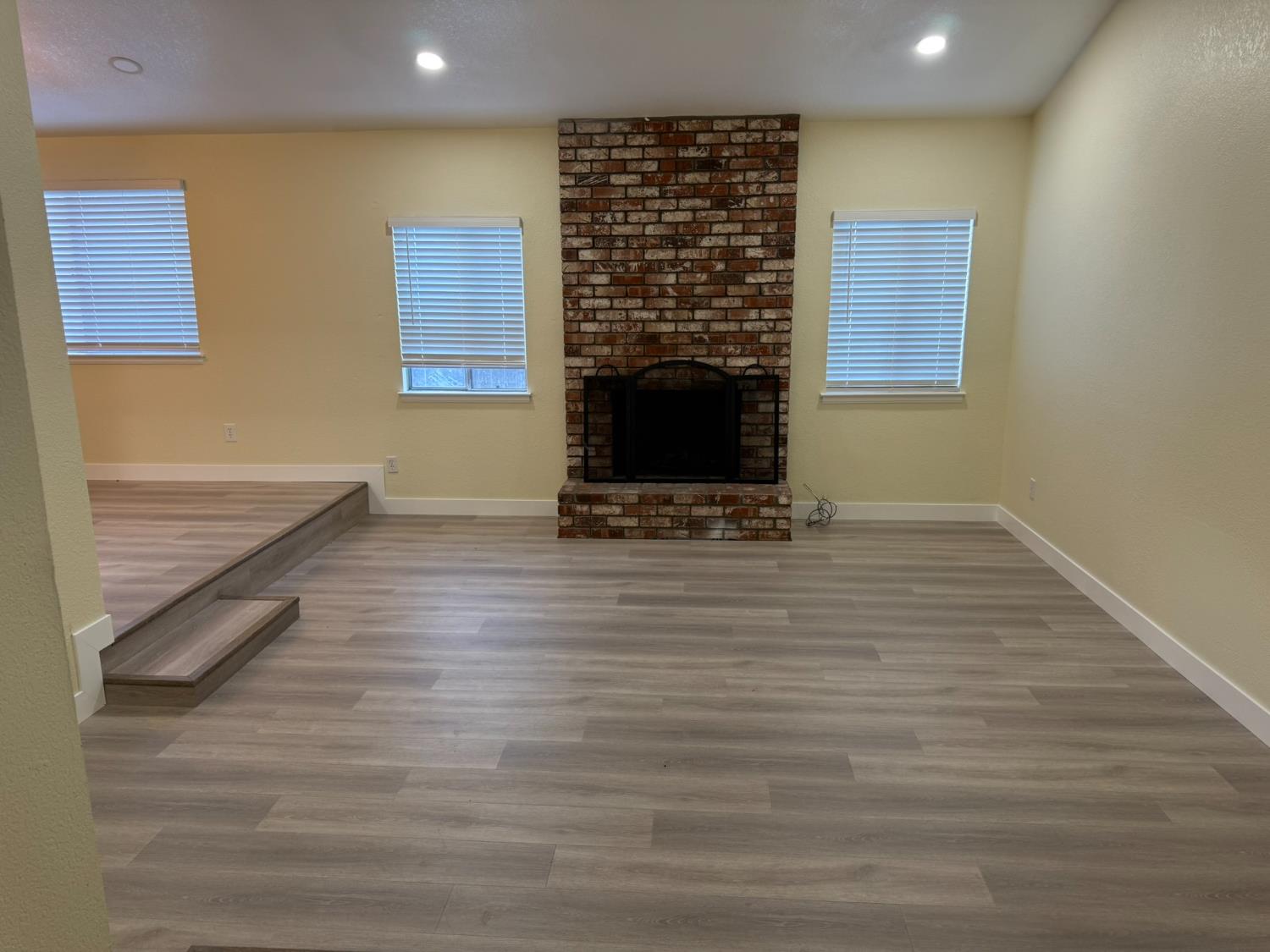 1909 Wagner Heights Road Stockton, CA 95209 - Photo 5 of 12 a living room with furniture and a fireplace