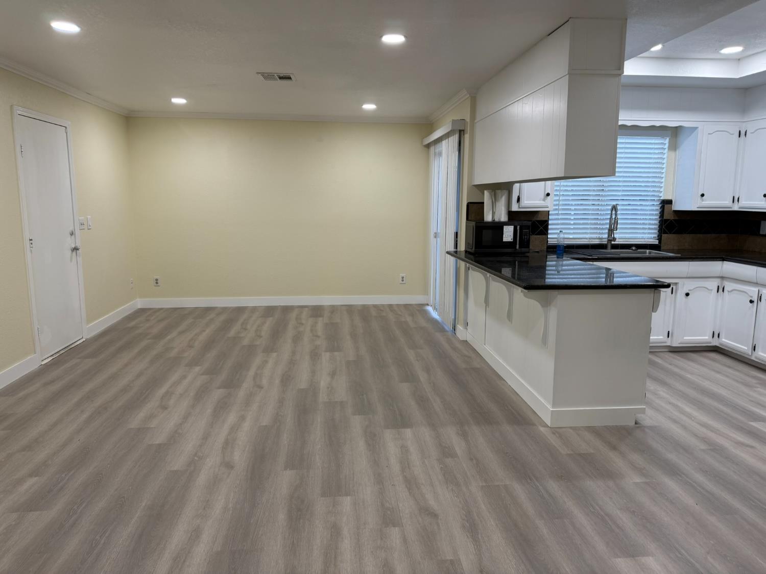 1909 Wagner Heights Road Stockton, CA 95209 - Photo 8 of 12 a kitchen with granite countertop a sink and cabinets