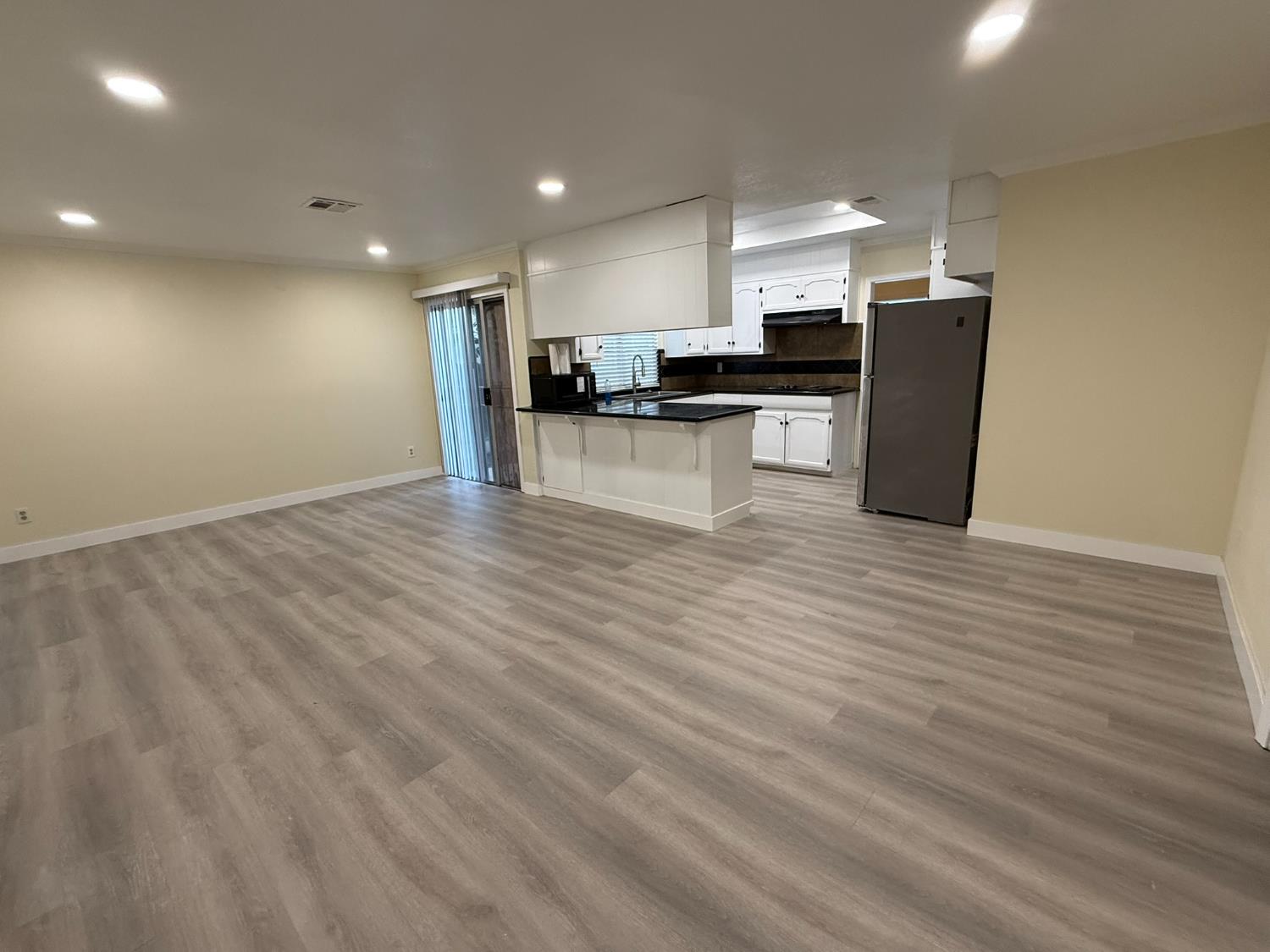 1909 Wagner Heights Road Stockton, CA 95209 - Photo 9 of 12 a view of kitchen view wooden floor stainless steel appliances and cabinets