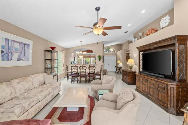a living room with furniture and white walls