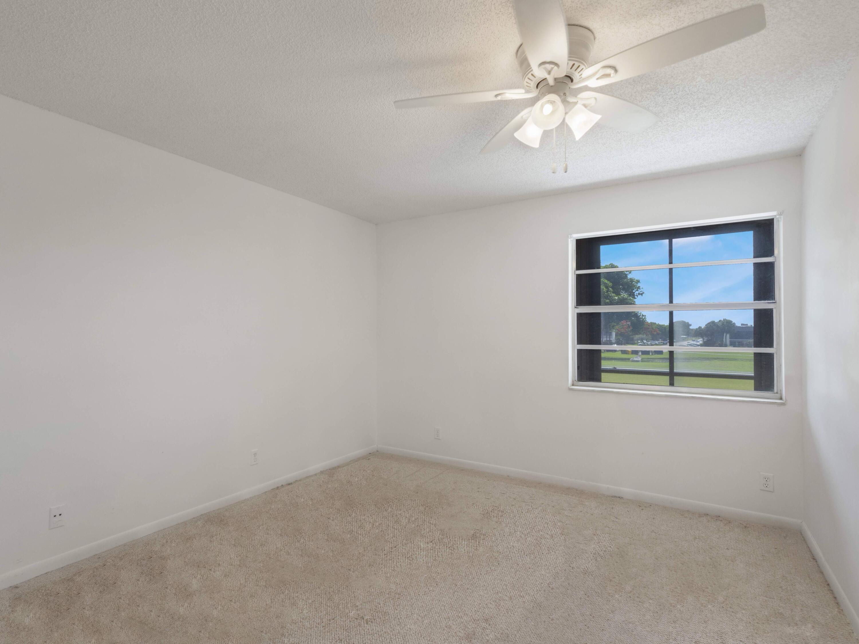 30 Flanders A Delray Beach, FL 33484 - Photo 16 of 38 Primary Bedroom