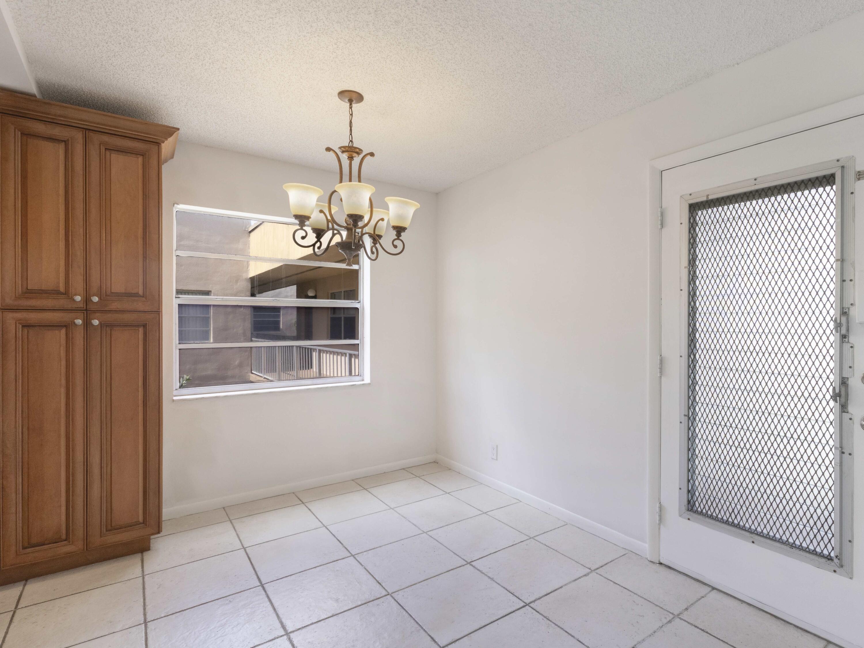 30 Flanders A Delray Beach, FL 33484 - Photo 8 of 38 Dining entry door