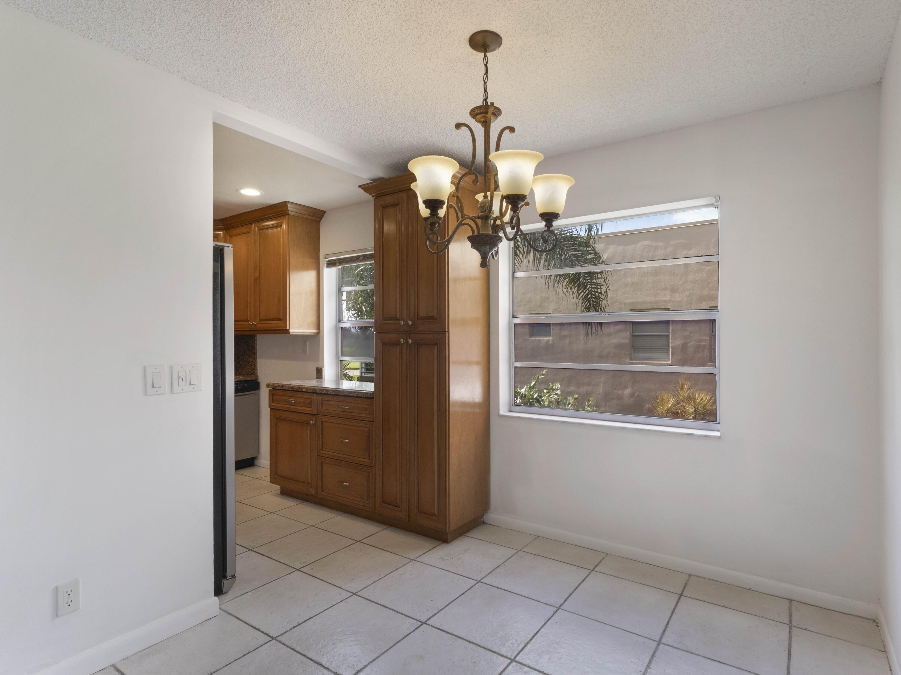 30 Flanders A Delray Beach, FL 33484 - Photo 9 of 38 Dining to Kitchen