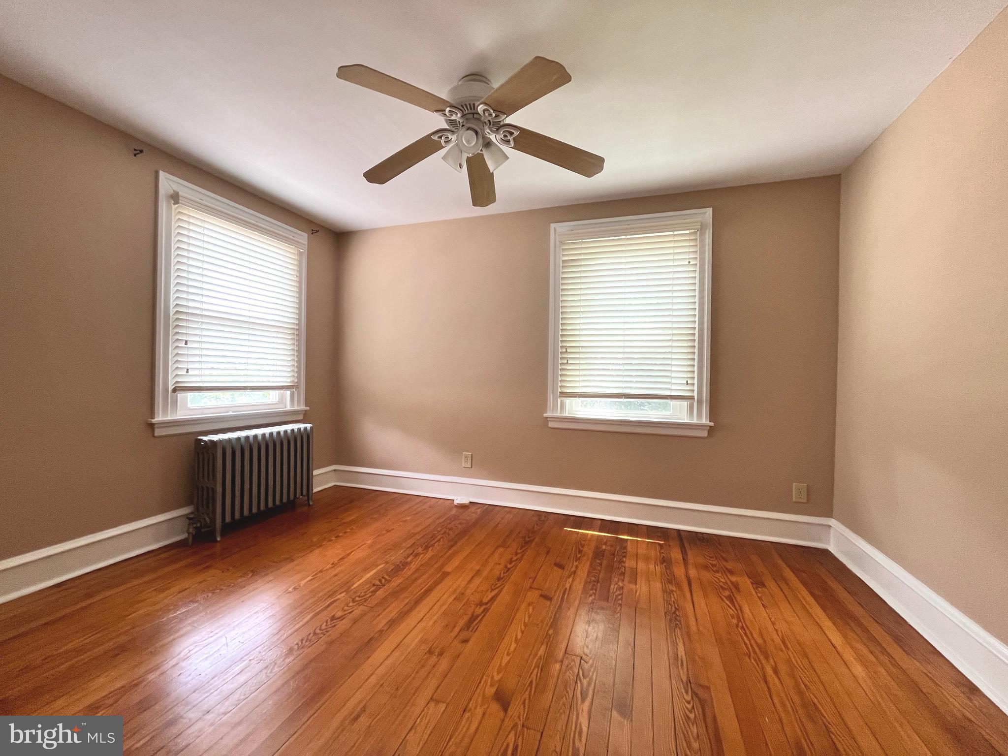 434 St Davids Avenue Wayne, PA 19087 - Photo 20 of 23 a view of an empty room with wooden floor and a window