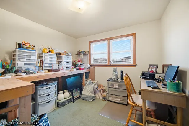 a room with furniture a piano and a bookshelf