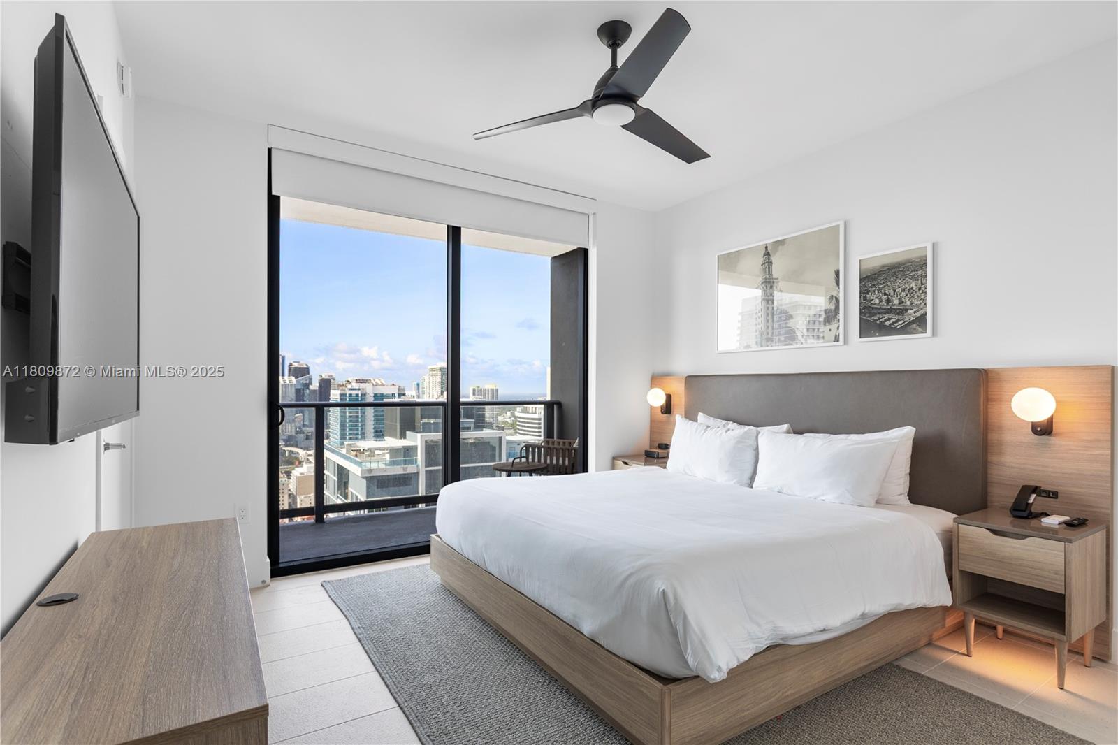 601 Northeast 1st Street, Unit 3907 Miami, FL 33132 - Photo 6 of 13 a bedroom with a large bed and a window