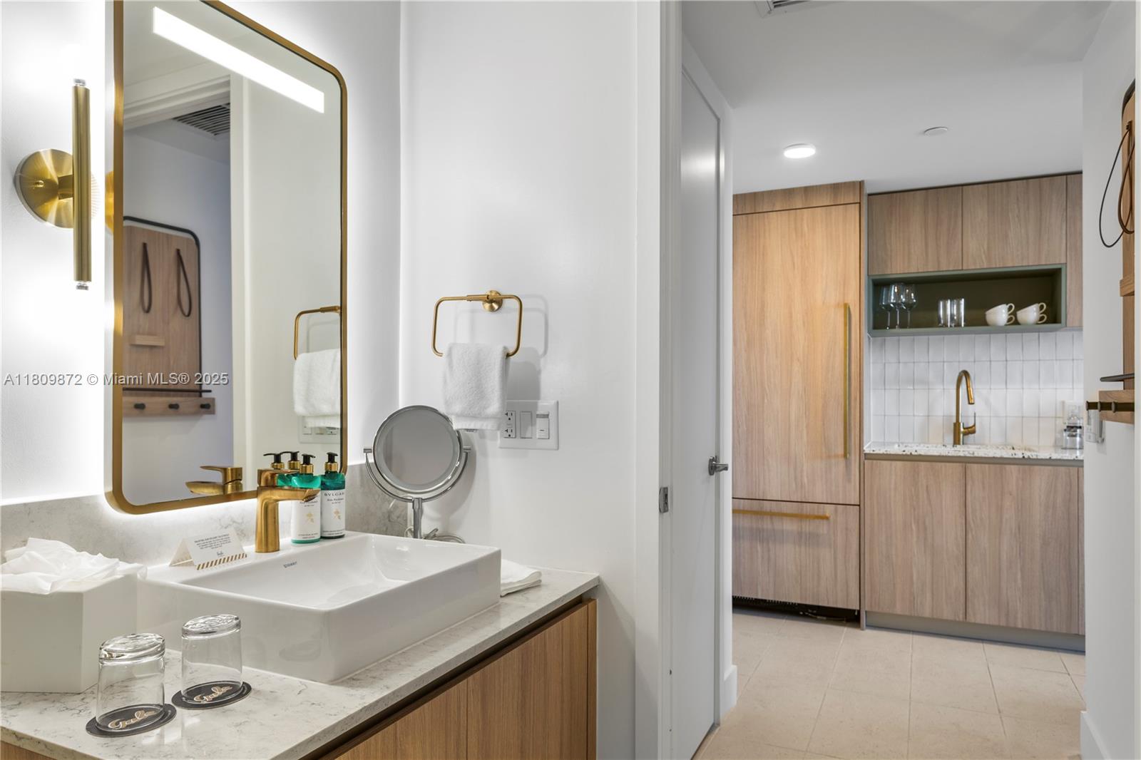 601 Northeast 1st Street, Unit 3907 Miami, FL 33132 - Photo 8 of 13 a kitchen with stainless steel appliances granite countertop a sink and a refrigerator