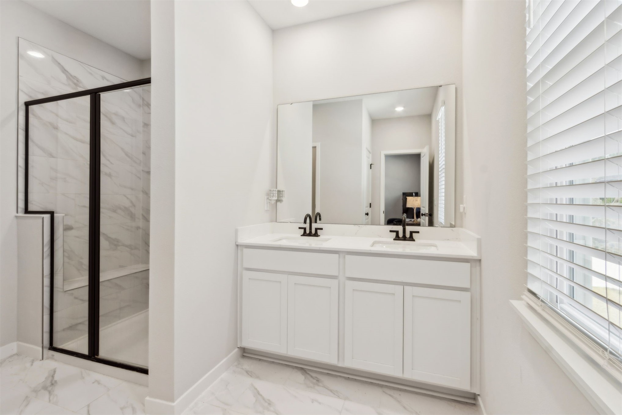 96277 Broadmoore Road Fernandina Beach, FL 32034 - Photo 14 of 26 a bathroom with a double vanity sink and mirror