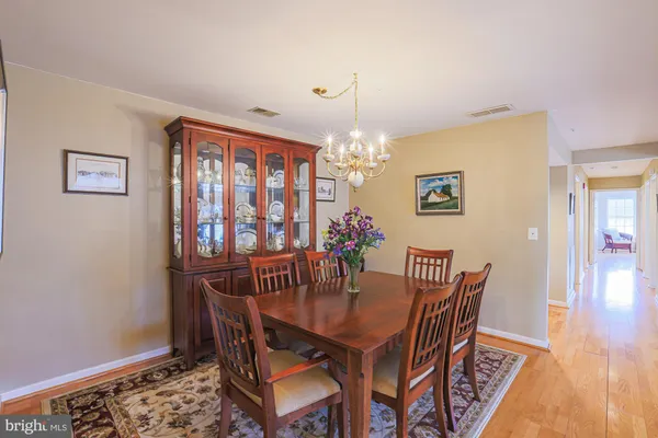 a workspace room with furniture and wooden floor