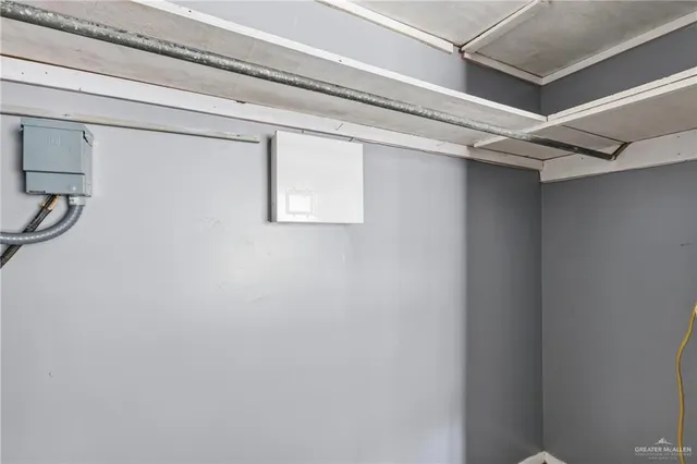 a view of a storage & utility room with a window