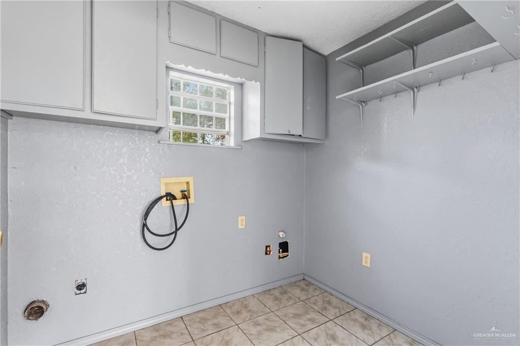 101 Ash Street Donna, TX 78537 - Photo 13 of 14 a view of a storage & utility room with a window