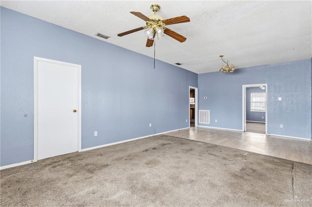101 Ash Street Donna, TX 78537 - Photo 3 of 14 an empty room with fan and ceiling fan