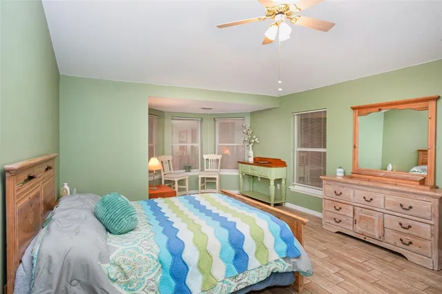 a bedroom with a bed and a dresser