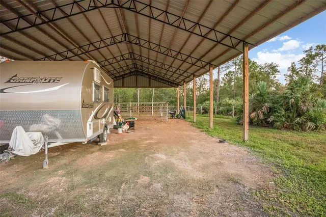 a view of a room with wooden floor and iron fence