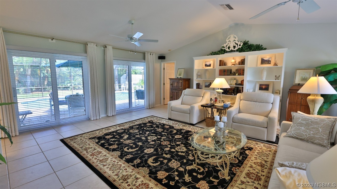 160 Packwood Road Edgewater, FL 32141 - Photo 11 of 31 a living room with furniture and a rug
