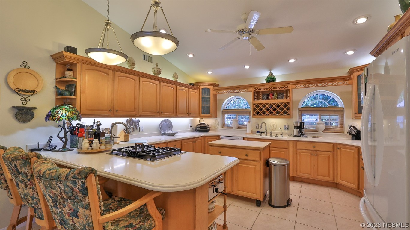 160 Packwood Road Edgewater, FL 32141 - Photo 13 of 31 a kitchen with stainless steel appliances granite countertop a sink a stove and a refrigerator