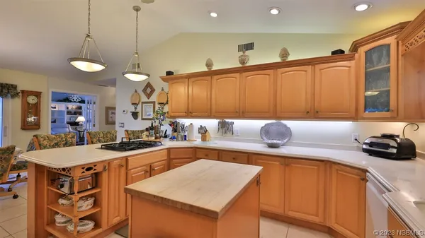 a kitchen with refrigerator cabinets and furniture