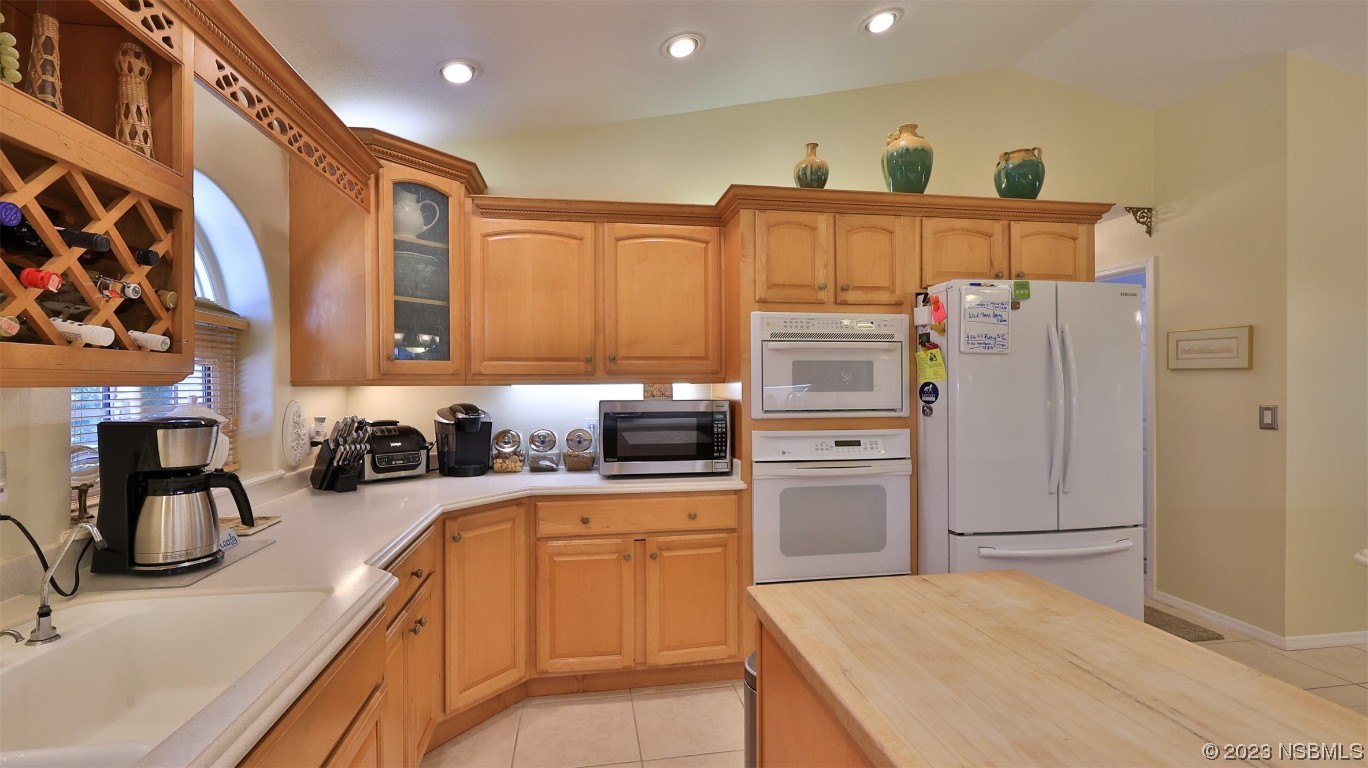 160 Packwood Road Edgewater, FL 32141 - Photo 15 of 31 a kitchen with refrigerator cabinets and furniture