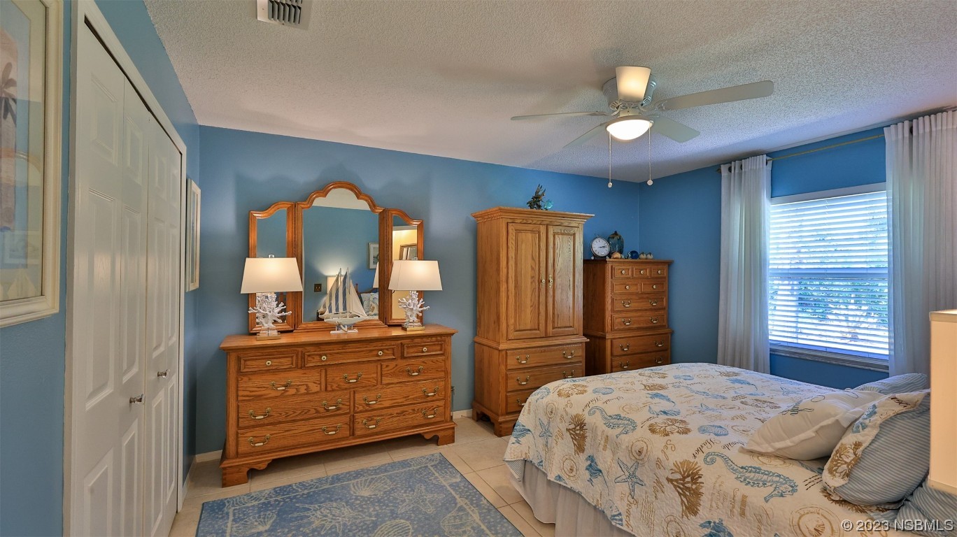 160 Packwood Road Edgewater, FL 32141 - Photo 22 of 31 a bedroom with a bed and a dresser