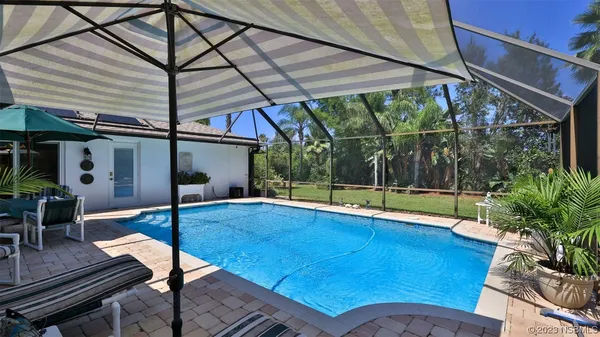 a view of a swimming pool with a patio