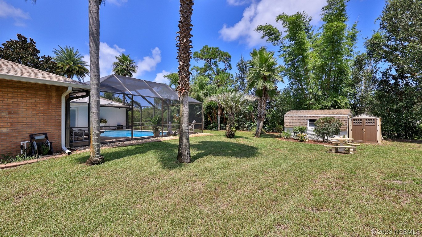 160 Packwood Road Edgewater, FL 32141 - Photo 30 of 31 a view of a house with a backyard