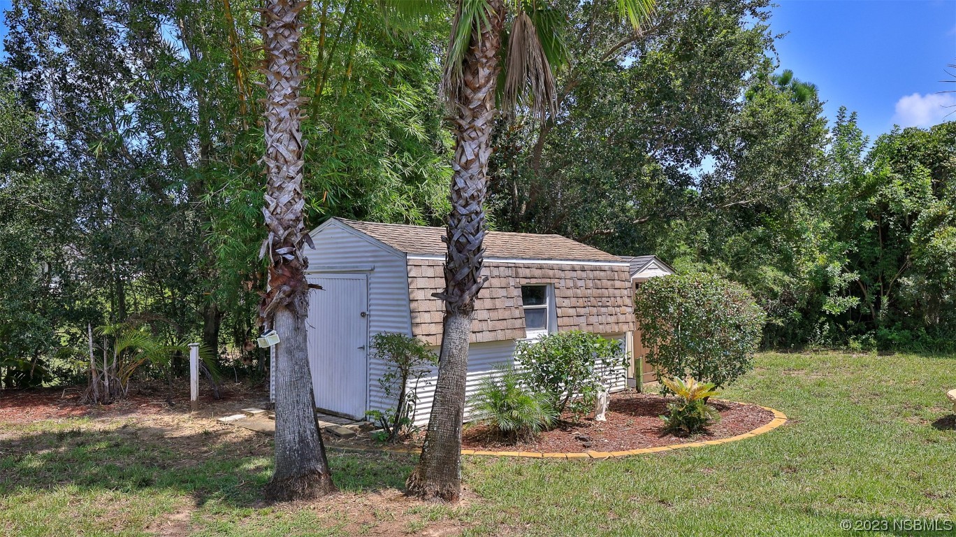 160 Packwood Road Edgewater, FL 32141 - Photo 31 of 31 a front view of a house with a yard