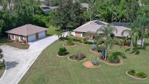 an aerial view of a house with garden