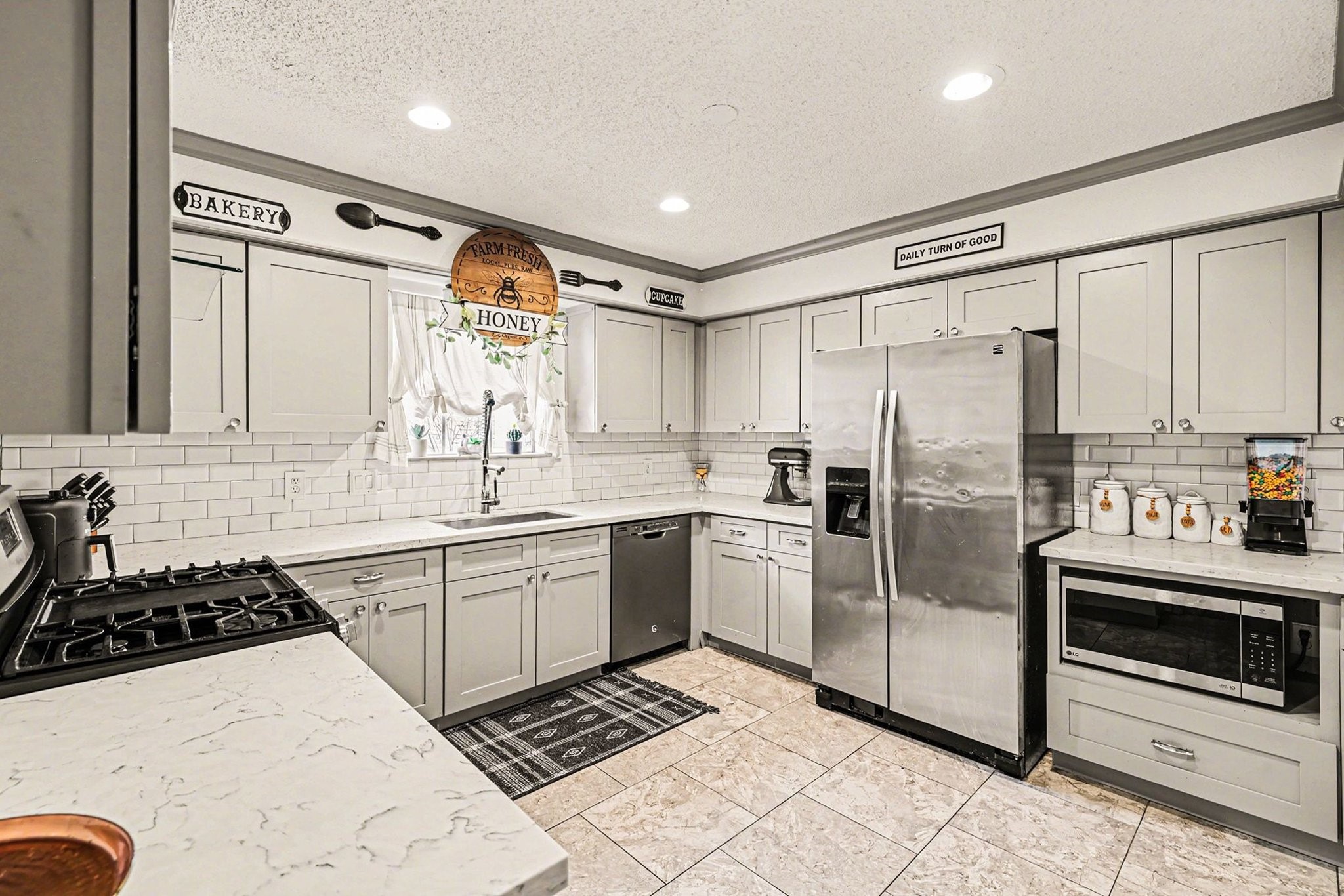 9530 Arcade Drive Spring, TX 77379 - Photo 17 of 37 Chef’s dream kitchen showcases stunning countertops, bright cabinetry, and stainless steel appliances.