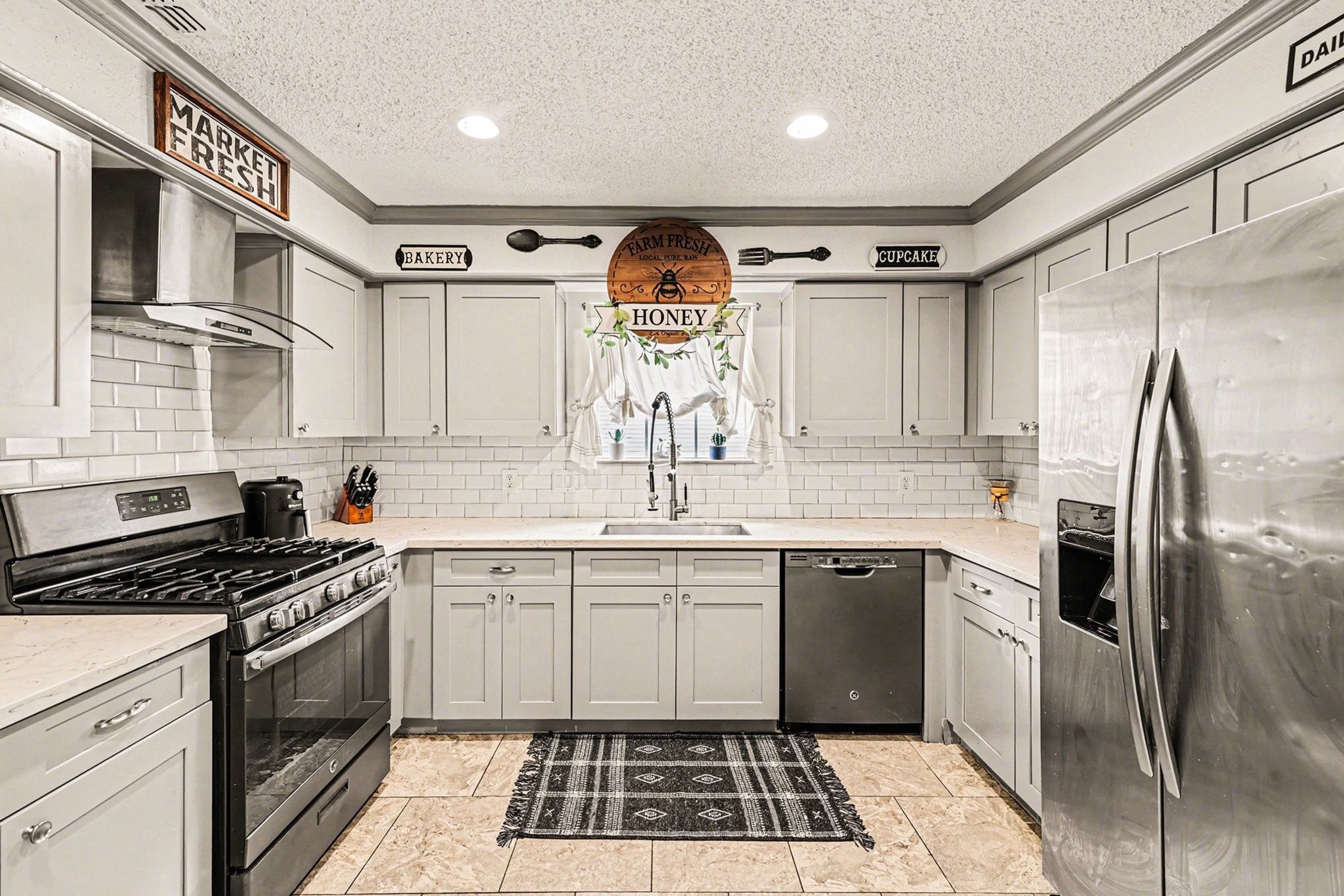 9530 Arcade Drive Spring, TX 77379 - Photo 18 of 37 This impressive kitchen is sure to impress with its modern style and thoughtful design.