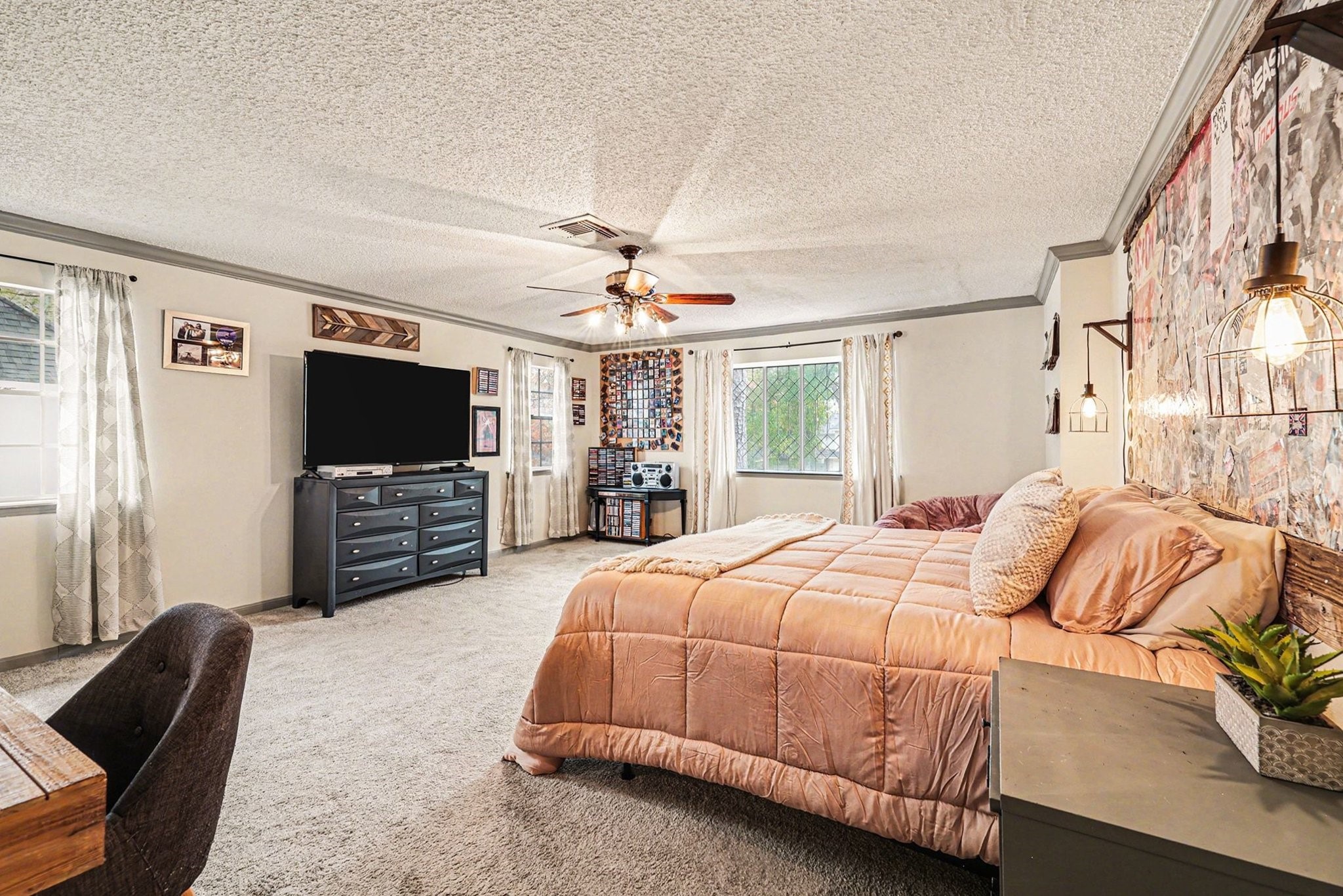 9530 Arcade Drive Spring, TX 77379 - Photo 28 of 37 Spacious upstairs primary bedroom offers plush carpeting, abundant natural light, and plenty of room to relax and unwind.