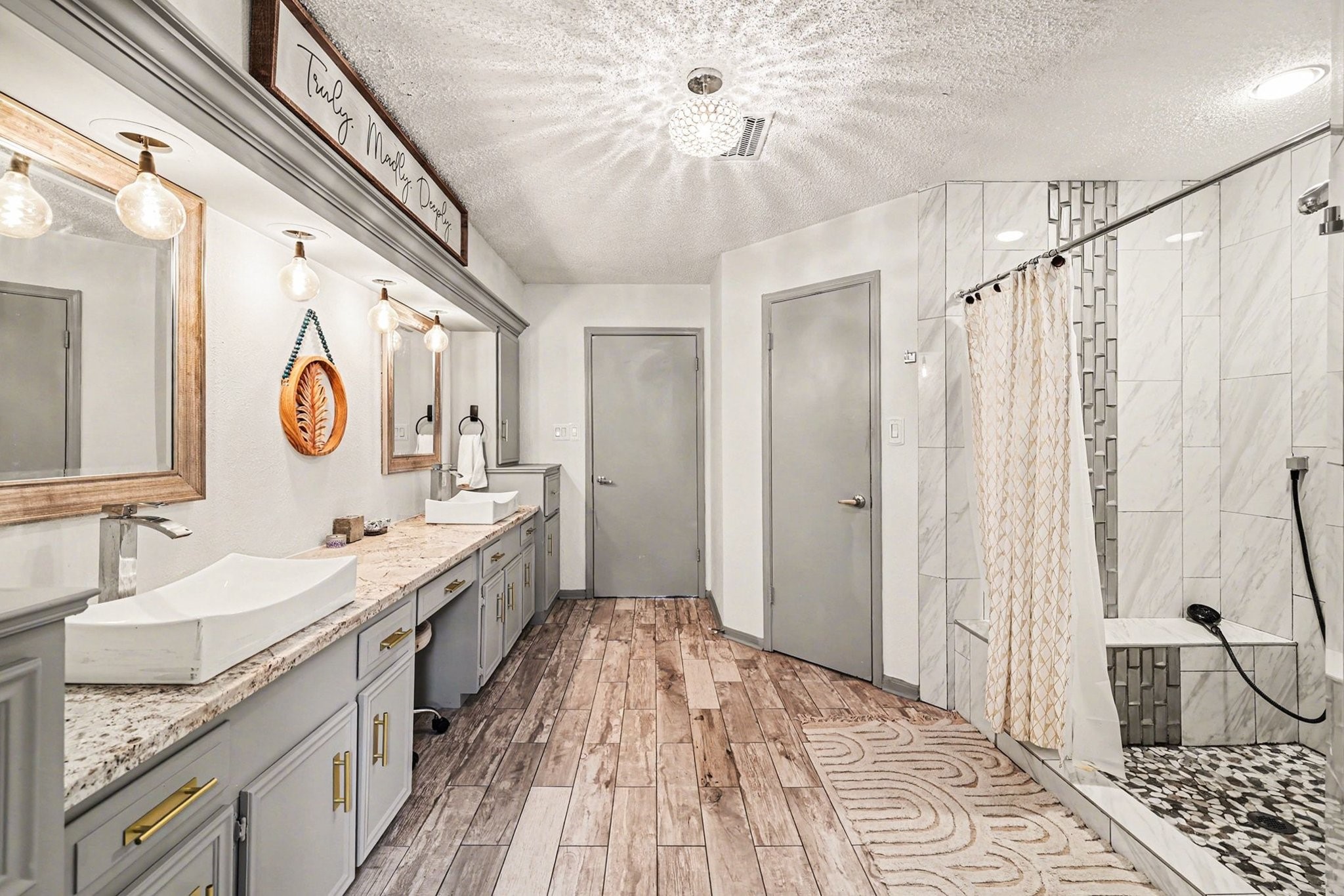 9530 Arcade Drive Spring, TX 77379 - Photo 31 of 37 This primary en suite also offers a beautiful shower and dual closets.