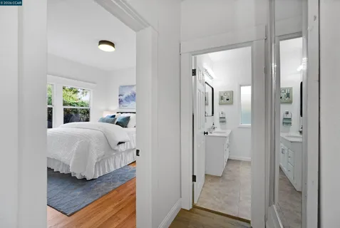 a en suite bathroom with a sink and a mirror
