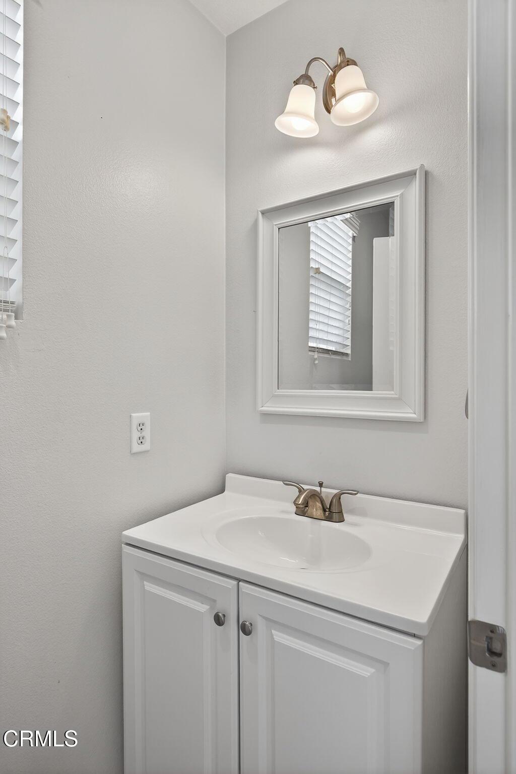 5331 Davidson Drive Oxnard, CA 93033 - Photo 16 of 38 a bathroom with a sink and a mirror