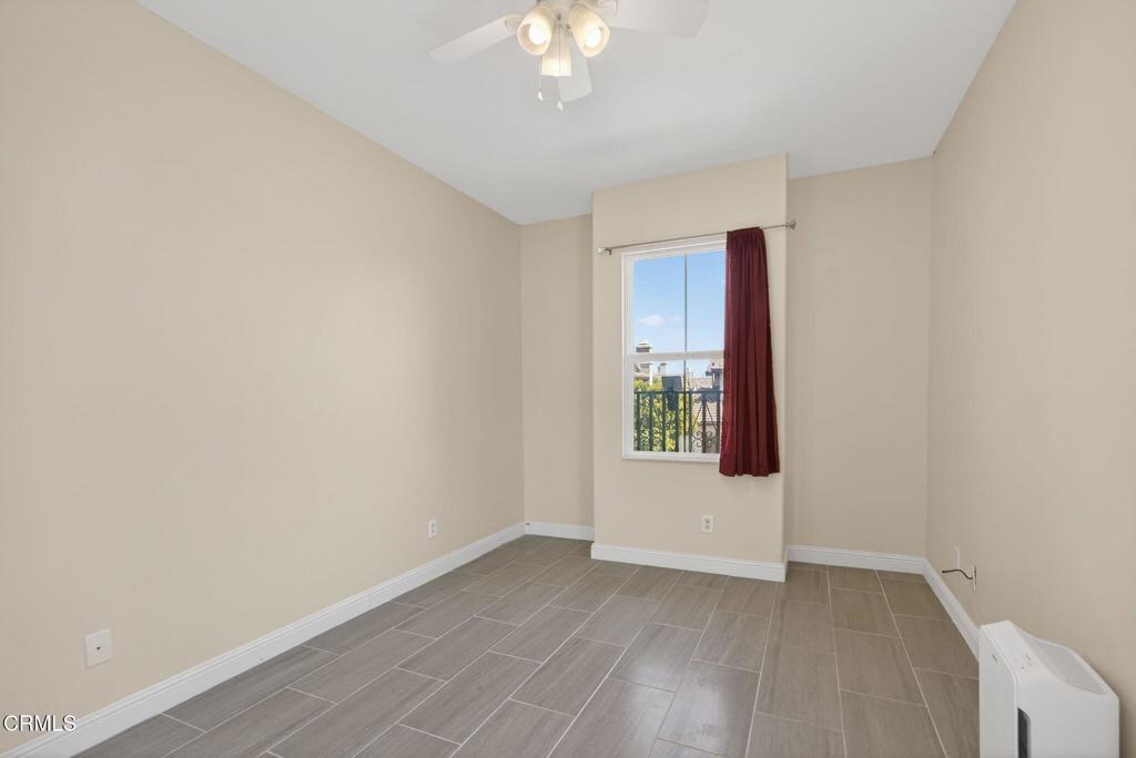 5331 Davidson Drive Oxnard, CA 93033 - Photo 19 of 38 an empty room with wooden floor and windows