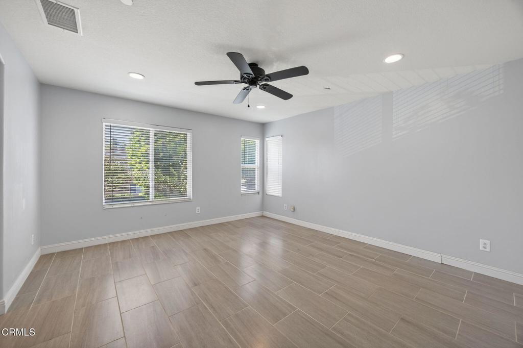 5331 Davidson Drive Oxnard, CA 93033 - Photo 23 of 38 wooden floor in an empty room with a window