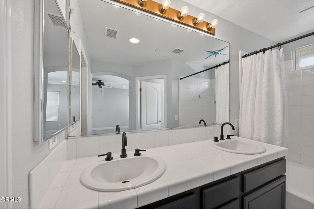 5331 Davidson Drive Oxnard, CA 93033 - Photo 27 of 38 a bathroom with a sink and a mirror