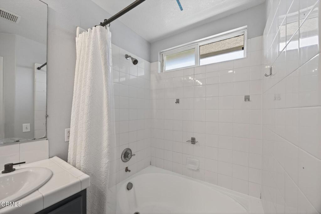 5331 Davidson Drive Oxnard, CA 93033 - Photo 29 of 38 a bathroom with a bathtub and a sink