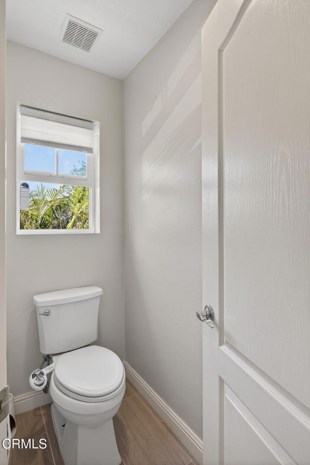 5331 Davidson Drive Oxnard, CA 93033 - Photo 30 of 38 a white toilet sitting next to a bathroom sink