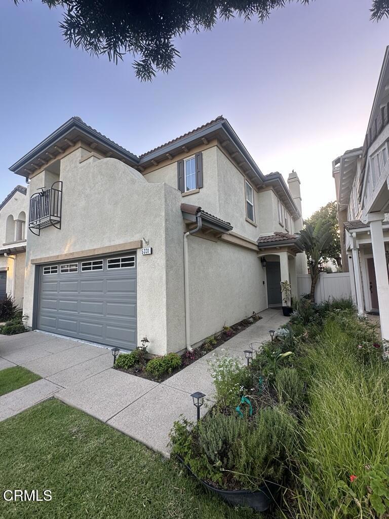 5331 Davidson Drive Oxnard, CA 93033 - Photo 5 of 38 a front view of a house with a yard and garage