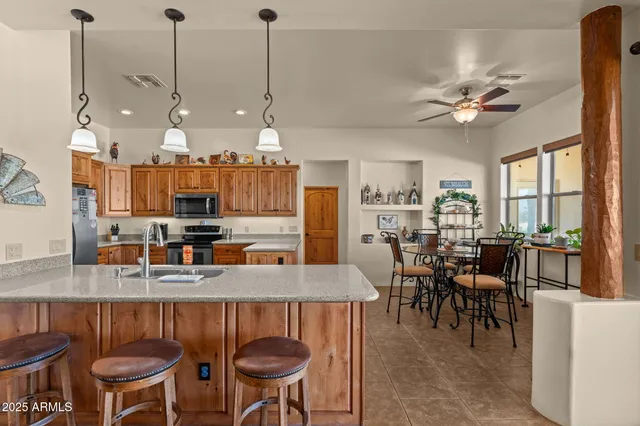 a dining room filled with furniture and a chandelier