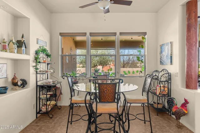 a view of a dining room with furniture window and outside view