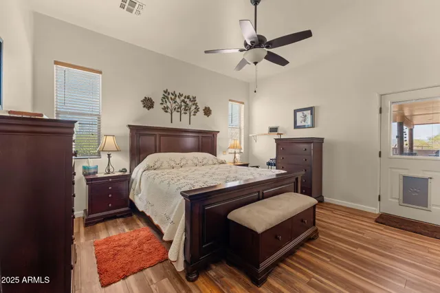 a bed room with a bed and a chandelier