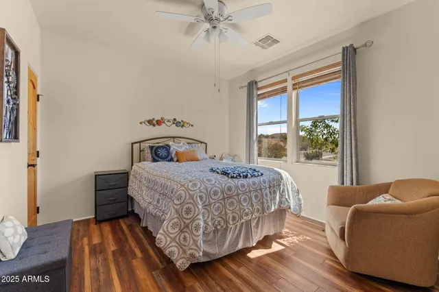 a view of a porch with furniture and a yard