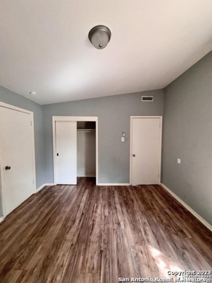 139 Crawford Road San Antonio, TX 78223 - Photo 9 of 13 a view of an empty room with wooden floor